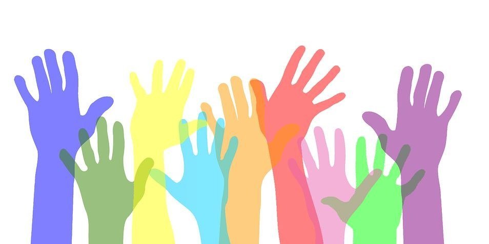Actions and Events - Colorful hands waving in air.