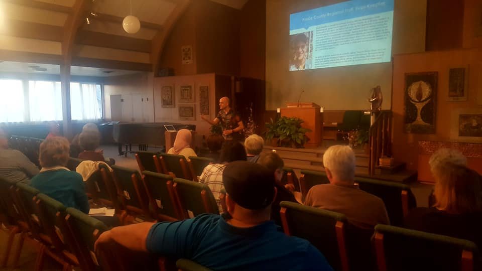 Evan Koepfler gives his Rise and Run presentation at the Indivisible Tacoma General meeting in March 2019.