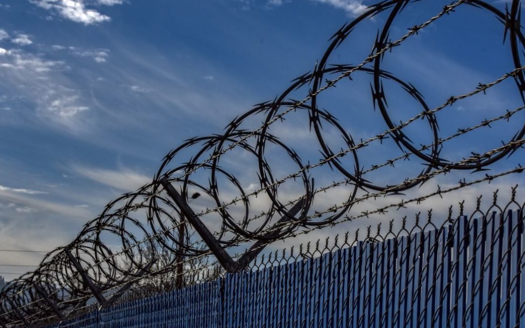 Close the Camps! - Photo of barbed wire fence.